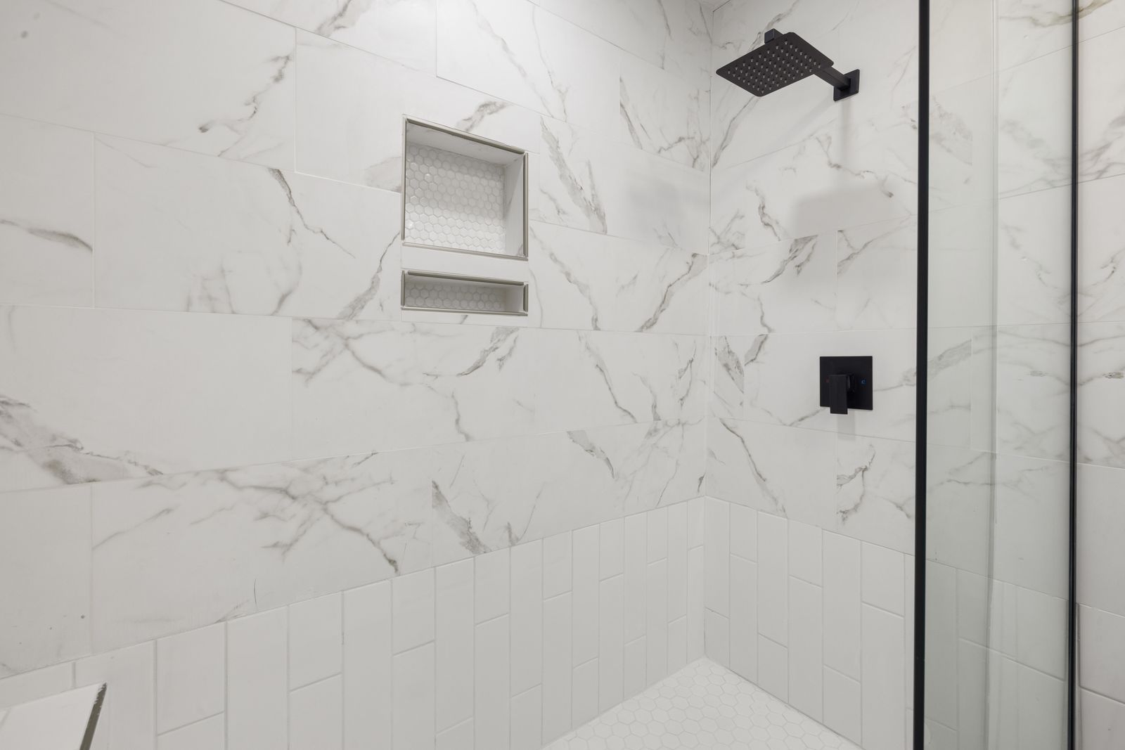 A bathroom under construction with solid backing installed behind the wall board