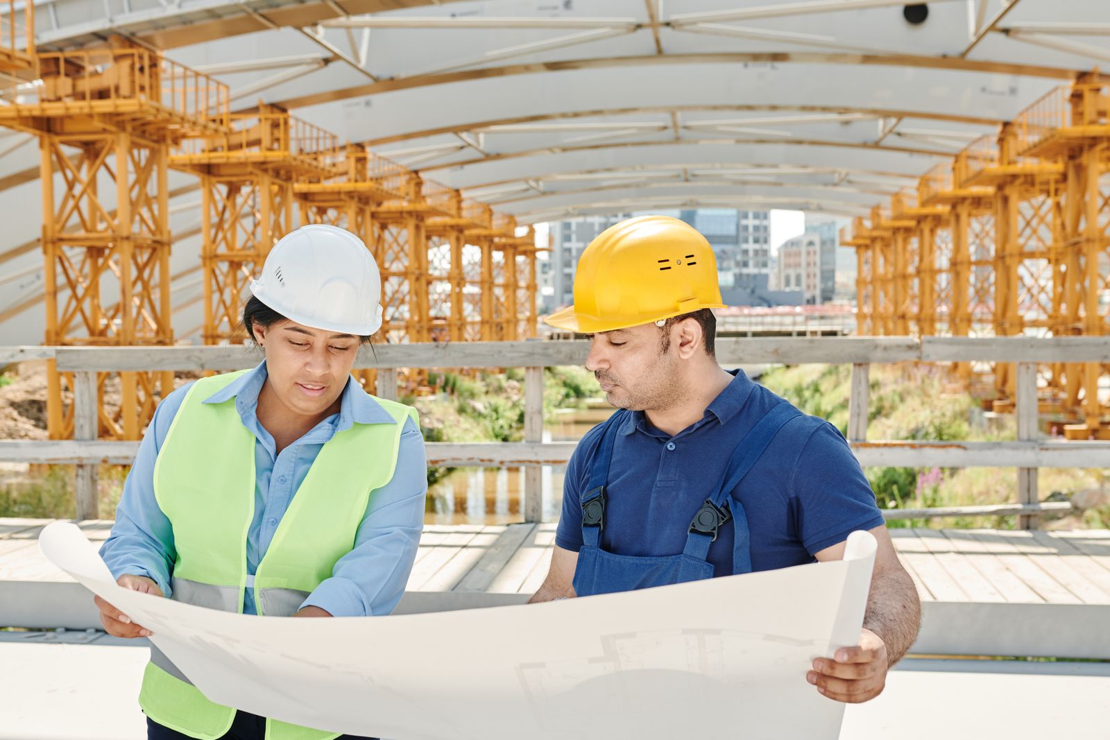 A superintendent walking a renovation with the drawings in hand